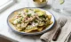 Chilaquiles Verdes Con Pollo: un Desayuno Con Sabor Mexicano Chilaquiles verdes con pollo con crema queso y aguacate