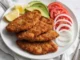 Milanesas de Res Empanizadas: un clásico que siempre funciona Milanesas de res empanizadas doradas y crujientes
